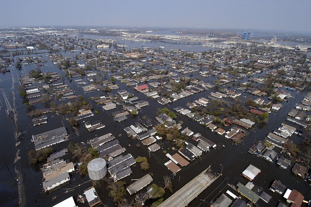 Flooded city with houses partially underwater.